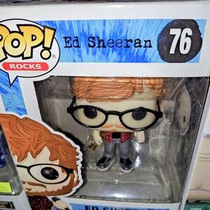 Funko Pop Rocks Figure with Red Hair and Black Glasses